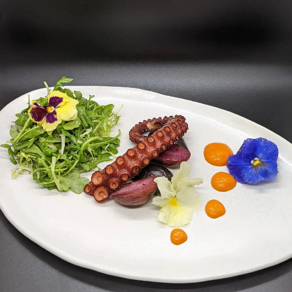 Try on Spanish octopus along with potato and salad