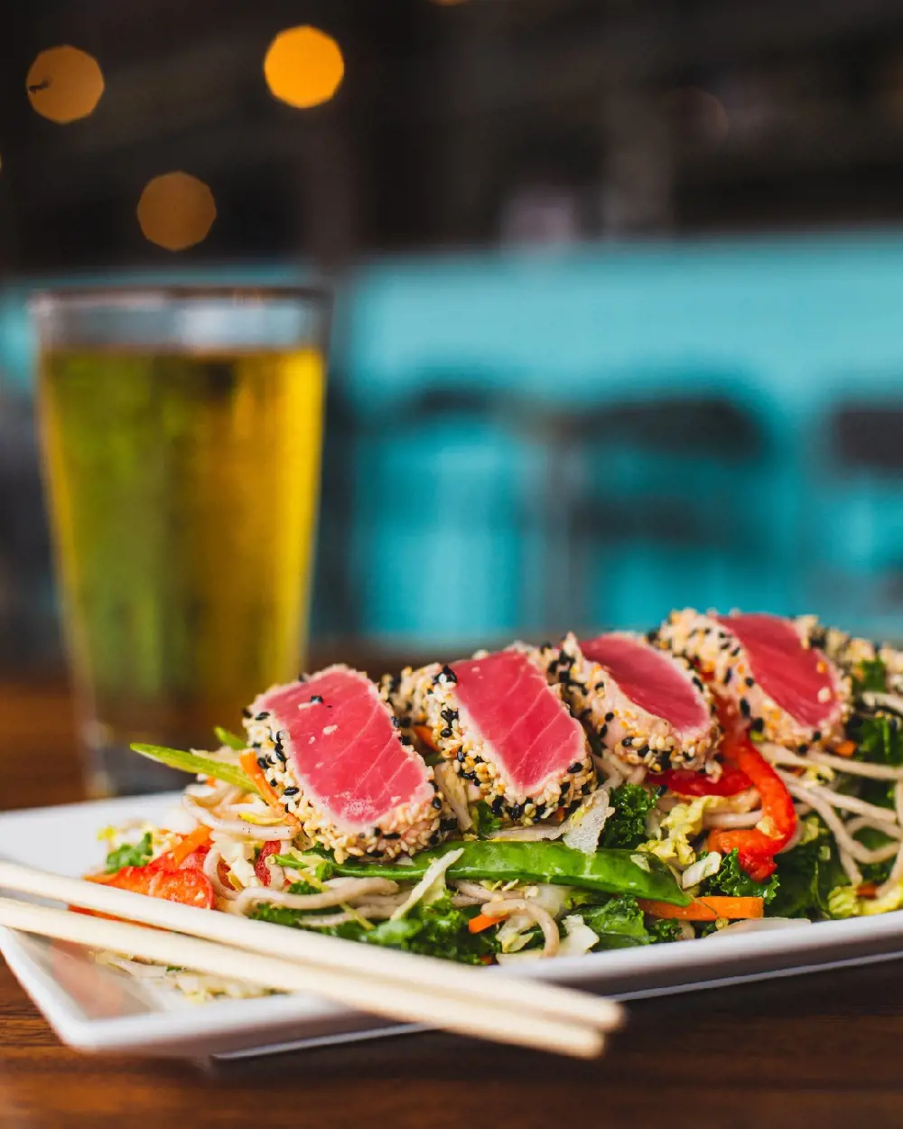 Thai Tuna Salad with sesame tuna, kale and cabbage is the must try dish