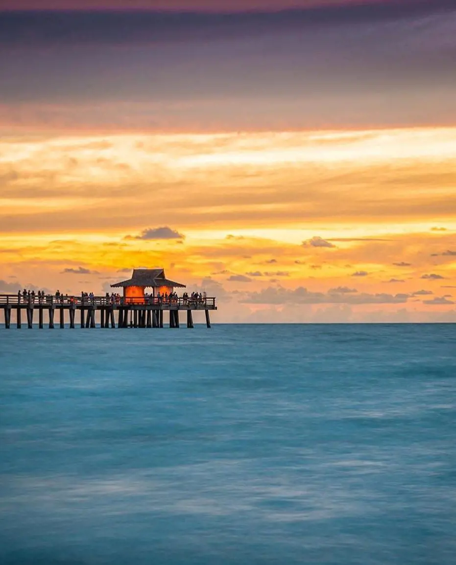 Watching the sunset form Naples Pier Beach is eye pleasing